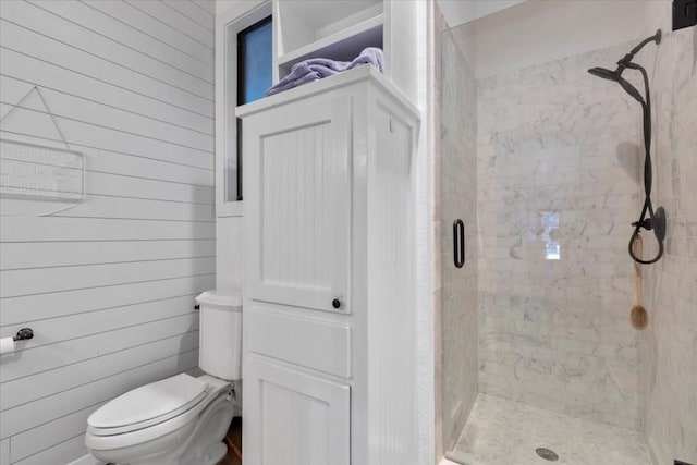 3805 Turkey Creek Dr, Austin, TX 78730 - bathroom featuring wooden walls, a shower stall, and toilet
