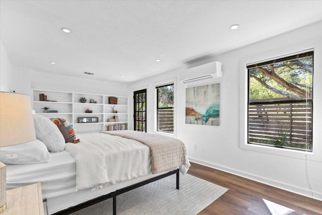 3805 Turkey Creek Dr, Austin, TX 78730 - bedroom featuring visible vents, recessed lighting, baseboards, wood finished floors, and a wall mounted AC