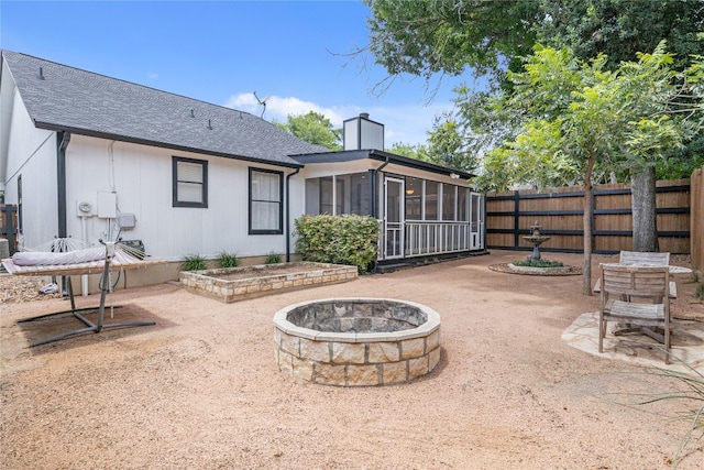 9831 Briar Ridge Dr, Austin, TX 78748 - fenced backyard with a fire pit, a sunroom, and a patio area