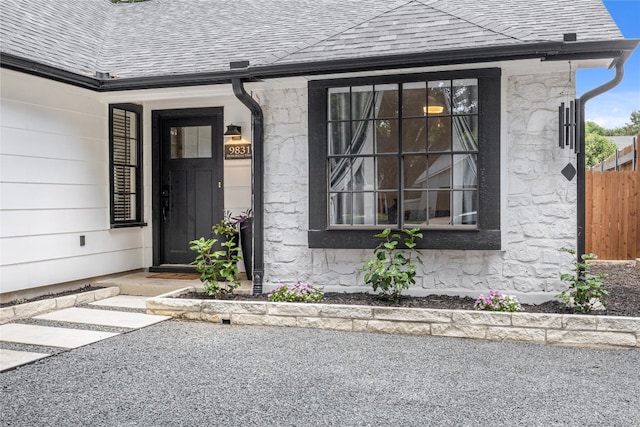 9831 Briar Ridge Dr, Austin, TX 78748 - doorway to property featuring stone siding and a shingled roof