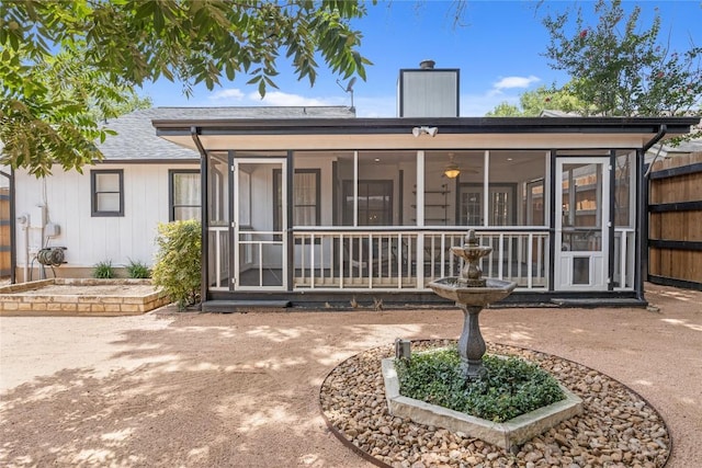 9831 Briar Ridge Dr, Austin, TX 78748 - back of house featuring a sunroom and a chimney