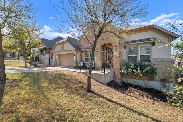 8409 Lookout Cliff Pass, Austin, TX 78737 - view of front of home with driveway, a front yard, stone siding, and stucco siding