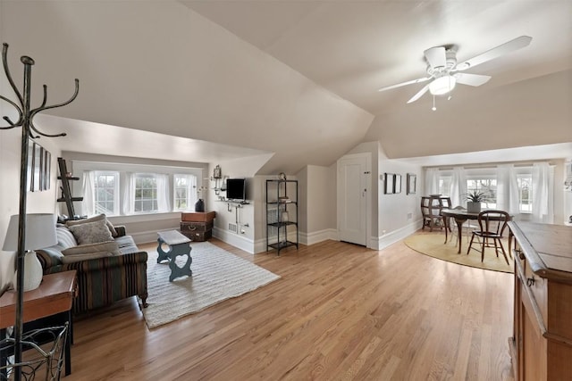 517 N 9th St, Temple, TX 76501 - living room featuring a ceiling fan, light wood finished floors, and vaulted ceiling