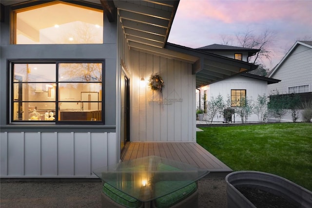 901 Wayside Dr, Austin, TX 78703 - exterior entry at dusk featuring a lawn