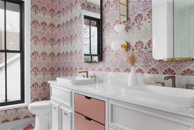 901 Wayside Dr, Austin, TX 78703 - bathroom with wallpapered walls, double vanity, and tile walls