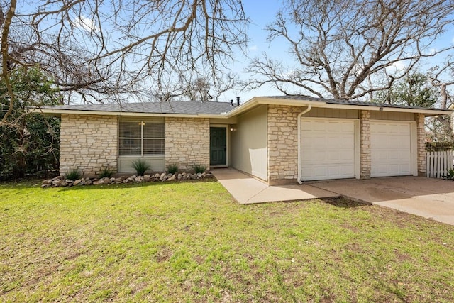11305 Songbird Cv, Austin, TX 78750 - view of front of home with stone siding, an attached garage, and driveway