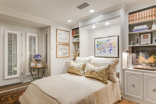 1304 Gaston Ave, Austin, TX 78703 - bedroom with access to exterior, wood finished floors, ornamental molding, and recessed lighting