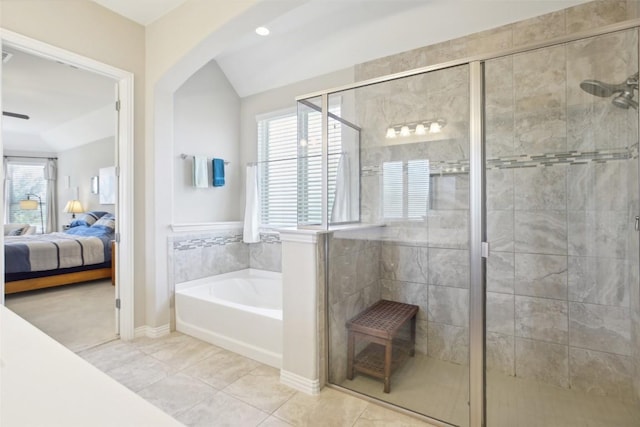 3036 Margarita Loop, Round Rock, TX 78665 - bathroom with a bath, connected bathroom, a shower stall, and healthy amount of natural light