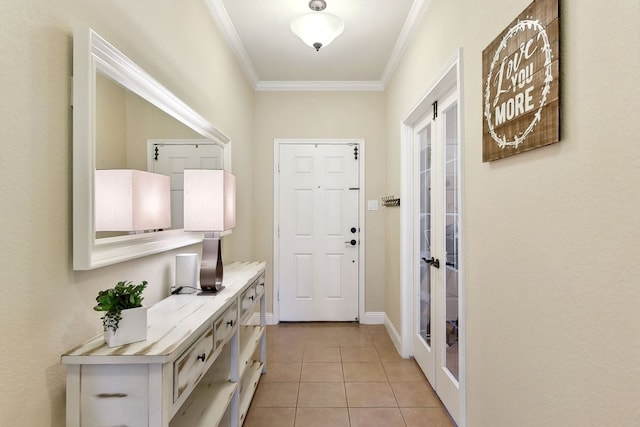 entryway with crown molding, light tile patterned floors, and french doors