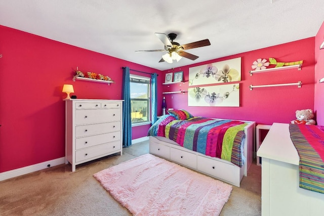 bedroom featuring carpet flooring, baseboards, and a ceiling fan