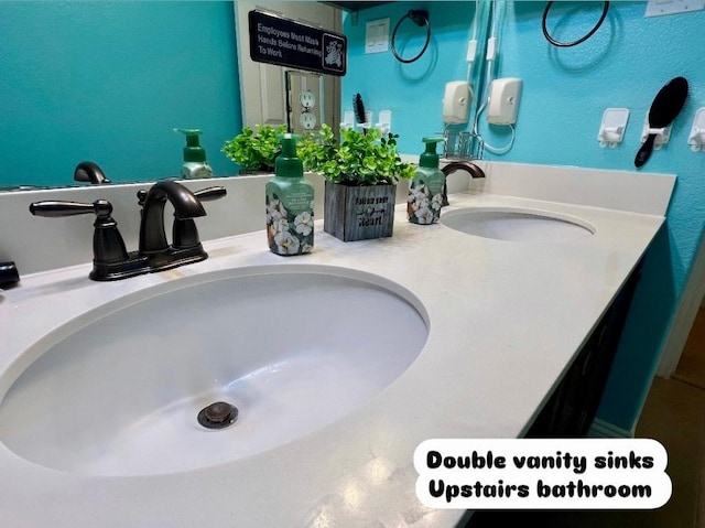 bathroom featuring double vanity and a sink
