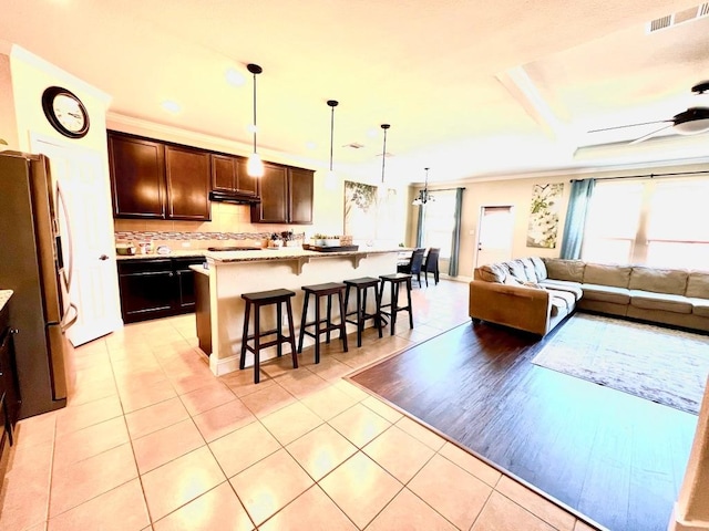 living room with visible vents, recessed lighting, a ceiling fan, and light tile patterned floors