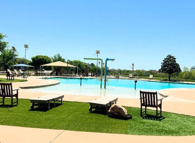 pool featuring a gazebo and a lawn