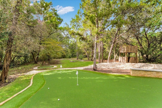 504 Konstanty Cir, Austin, TX 78746 - view of property's community featuring a putting green and view of scattered trees