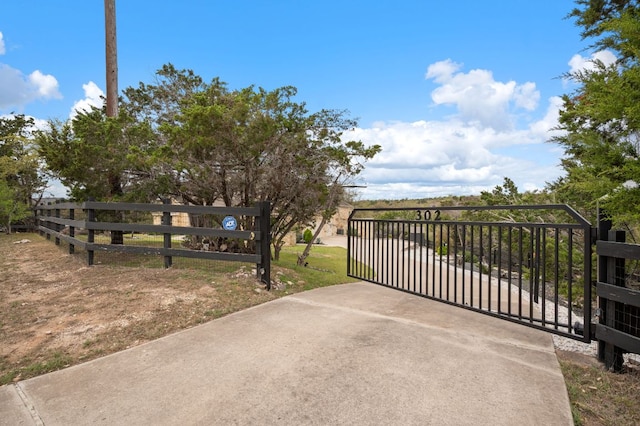 view of gate featuring fence