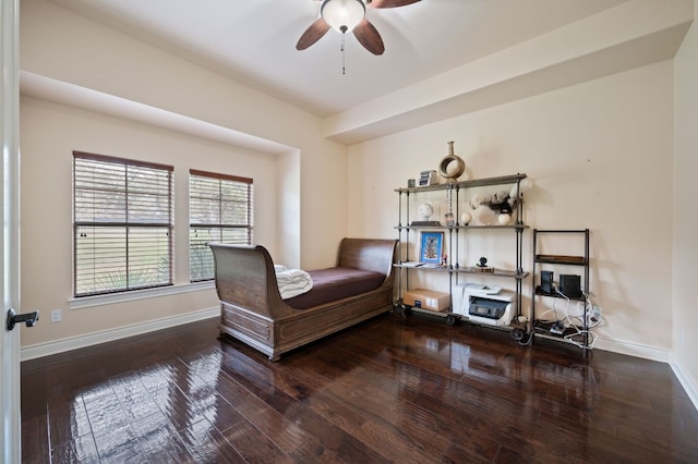bedroom with baseboards and hardwood / wood-style flooring