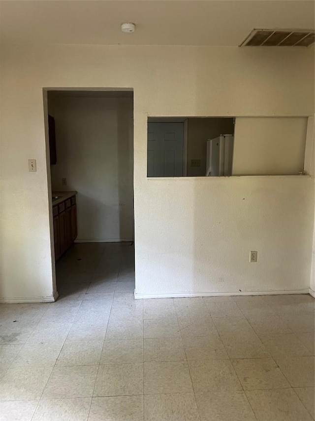 410 Railroad St, San Marcos, TX 78666 - unfurnished room featuring a smoke detector and baseboards