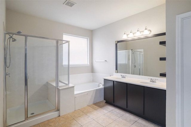 19803 Mallard Pond Trl, Pflugerville, TX 78660 - full bath with a shower stall, double vanity, a garden tub, and tile patterned flooring