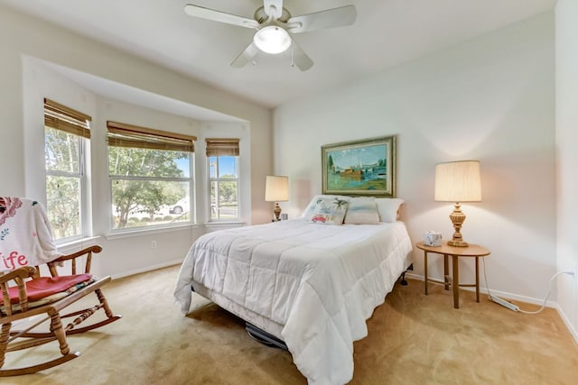 104 Plover Pass, Georgetown, TX 78633 - bedroom featuring baseboards, light colored carpet, and ceiling fan
