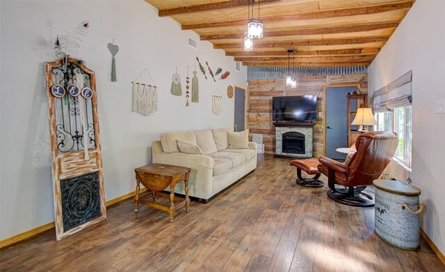 3205 Menchaca Rd, Austin, TX 78704 - living area featuring a fireplace, beamed ceiling, hardwood / wood-style flooring, and baseboards