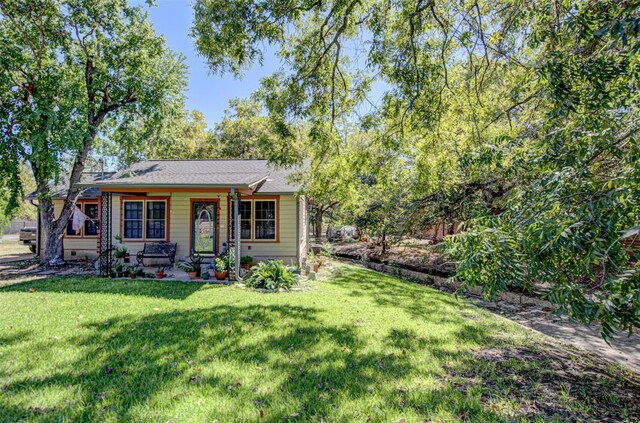 3205 Menchaca Rd, Austin, TX 78704 - view of front of house featuring a front yard and a porch