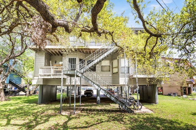 5306 Indio Cv, Austin, TX 78745 - rear view of house featuring stairs, a yard, and a deck