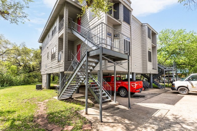 5306 Indio Cv, Austin, TX 78745 - view of property with stairs and central AC unit