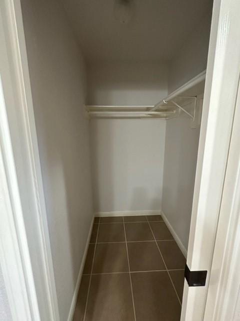 11708 Bittern Holw, Austin, TX 78758 - walk in closet with dark tile patterned flooring