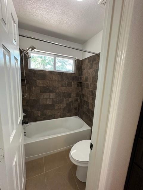 11708 Bittern Holw, Austin, TX 78758 - full bath with a textured ceiling, toilet, tile patterned flooring, and bathing tub / shower combination