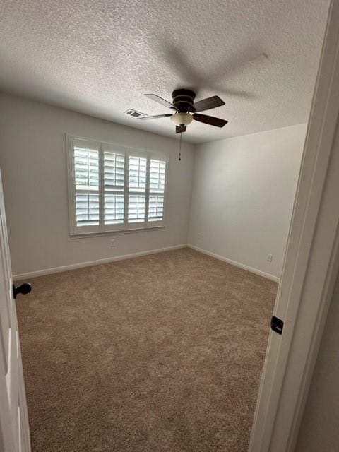 11708 Bittern Holw, Austin, TX 78758 - carpeted empty room with ceiling fan, a textured ceiling, and baseboards