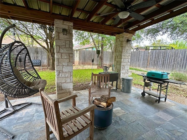 11708 Bittern Holw, Austin, TX 78758 - fenced backyard with a ceiling fan, area for grilling, and a patio