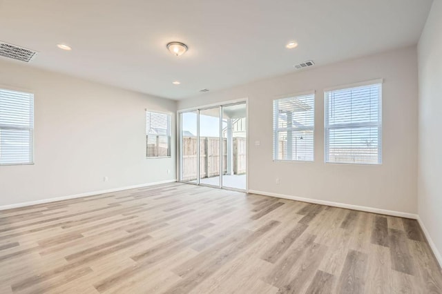 303 Elm Branch Trl, Taylor, TX 76574 - empty room with light wood-style floors and recessed lighting