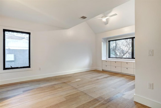 2009 Riverview St, Austin, TX 78702 - empty room featuring lofted ceiling, light wood-style floors, baseboards, and ceiling fan