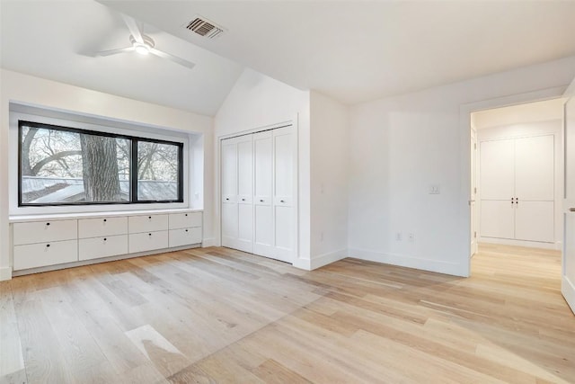 2009 Riverview St, Austin, TX 78702 - unfurnished bedroom with vaulted ceiling, light wood-style floors, baseboards, a closet, and ceiling fan