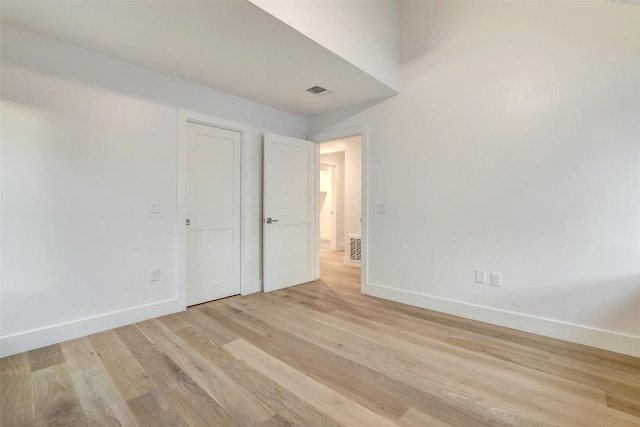 2009 Riverview St, Austin, TX 78702 - unfurnished bedroom with baseboards and light wood-type flooring