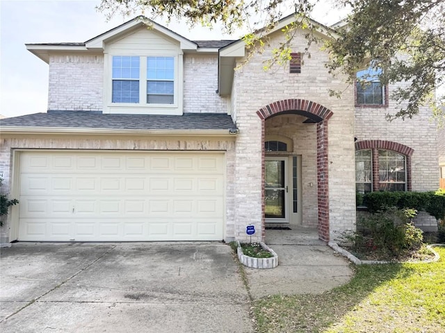 13004 Kenswick Dr, Austin, TX 78753 - view of front of property with driveway, an attached garage, and brick siding