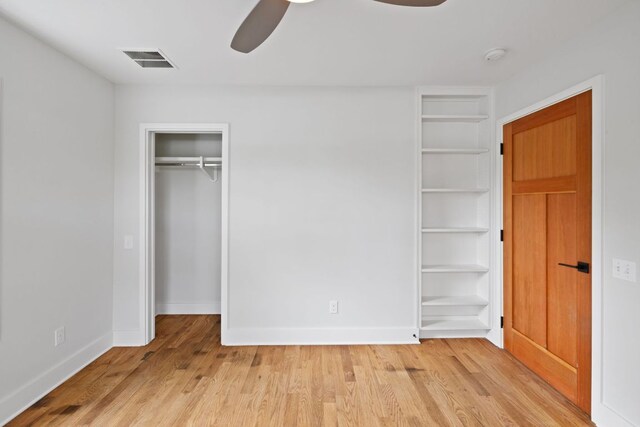 2300 S 3rd St, Austin, TX 78704 - unfurnished bedroom with light wood-style floors, baseboards, and ceiling fan
