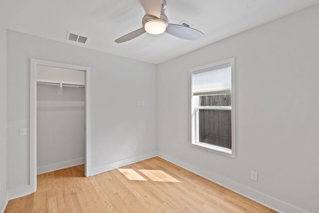 2300 S 3rd St, Austin, TX 78704 - unfurnished bedroom with a closet, light wood-style floors, baseboards, and ceiling fan