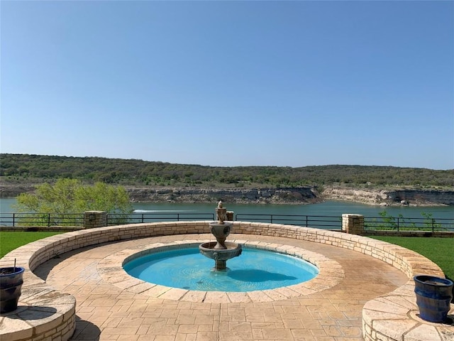3404 American Dr Unit 2202, Lago Vista, TX 78645 - view of pool featuring a water view and a wooded view