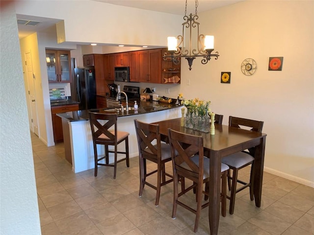 3404 American Dr Unit 2202, Lago Vista, TX 78645 - dining area featuring light tile patterned floors and a chandelier