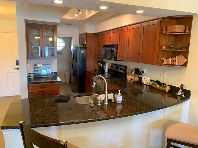 3404 American Dr Unit 2202, Lago Vista, TX 78645 - kitchen featuring freestanding refrigerator, black microwave, electric stove, a peninsula, and dark stone counters