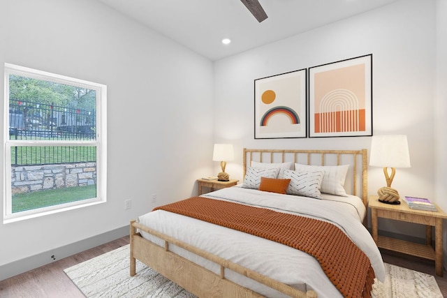 2450 Wickersham Ln Unit 2013, Austin, TX 78741 - bedroom with wood finished floors, baseboards, recessed lighting, and ceiling fan