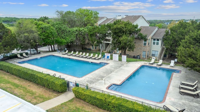 2450 Wickersham Ln Unit 2013, Austin, TX 78741 - community pool with fence and a patio