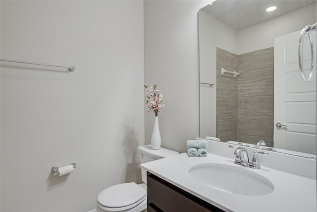 13800 Lyndhurst St Unit 325, Austin, TX 78717 - full bathroom featuring toilet, vanity, and tiled shower