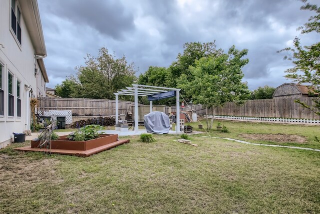 1329 Amberwood Loop, Kyle, TX 78640 - view of yard featuring a pergola, a vegetable garden, and a patio area