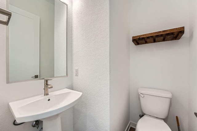3213 Zach Scott St, Austin, TX 78723 - half bathroom with a sink and toilet
