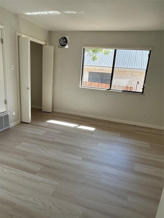 712 Rolling Green Dr, Lakeway, TX 78734 - empty room featuring baseboards, visible vents, and light wood-style flooring