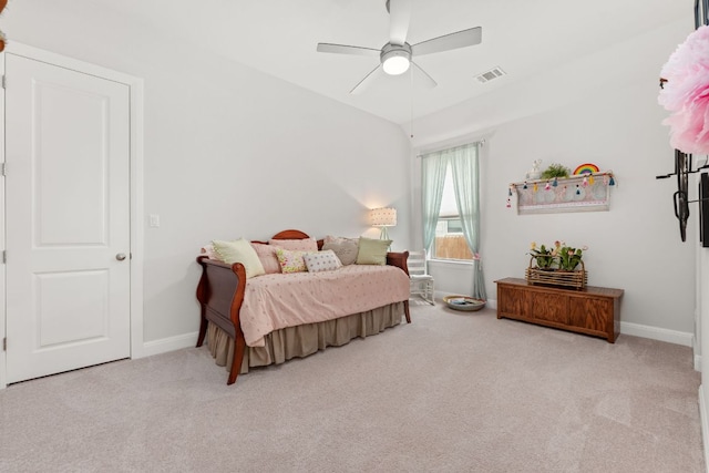carpeted bedroom featuring visible vents, a ceiling fan, and baseboards