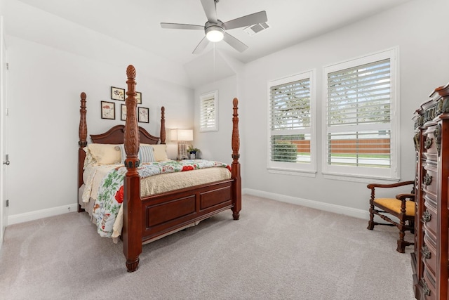bedroom with visible vents, light colored carpet, and baseboards