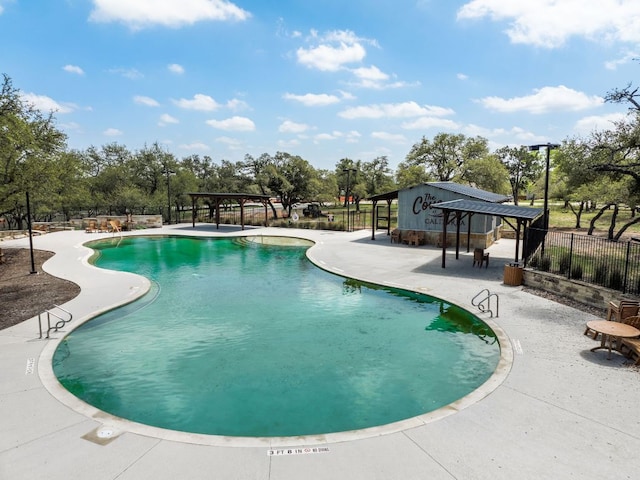 390 Double L Dr, Dripping Springs, TX 78620 - community pool featuring a gazebo, a patio area, and view of scattered trees